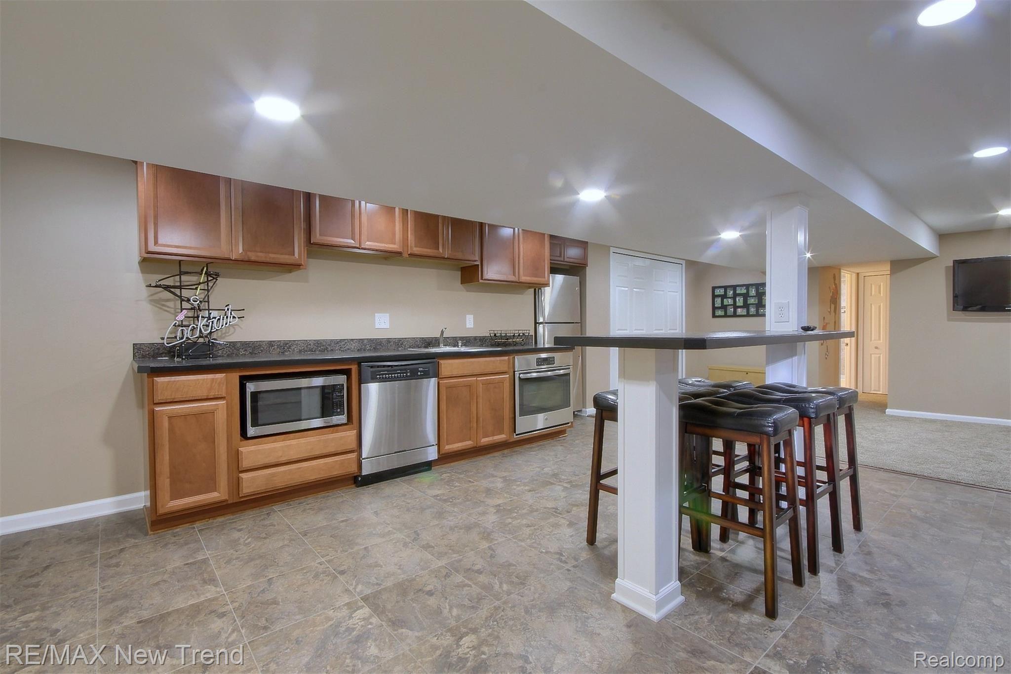 48580 Rockefeller Drive Canton, MI 48188 - Photo 25 of 30 25-Finished Lower Level 2nd View.jpg