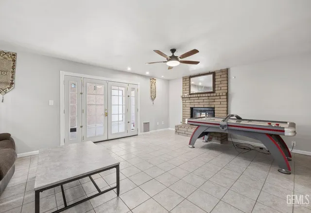 a living room with furniture a dining table and a rug