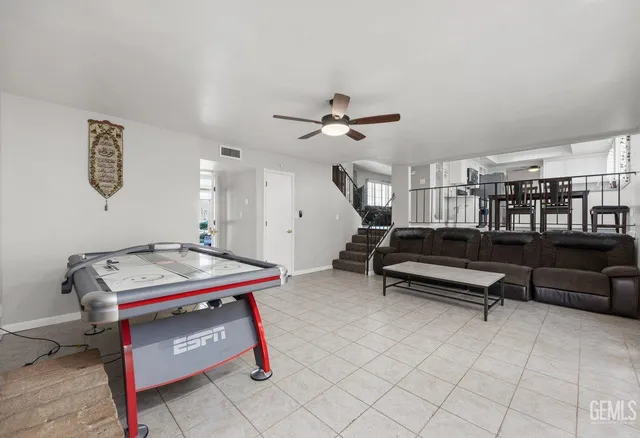 a bedroom with furniture and window