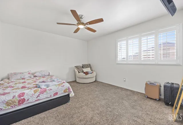 a bedroom with bed and a window