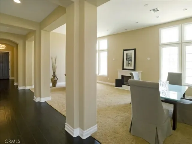 a view of a livingroom with furniture and a window