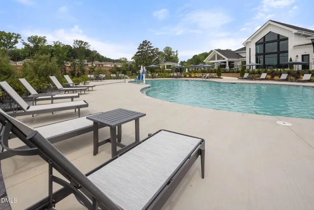 a view of a fountain in front of a house