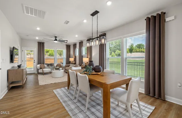 a kitchen with granite countertop a sink stainless steel appliances and cabinets
