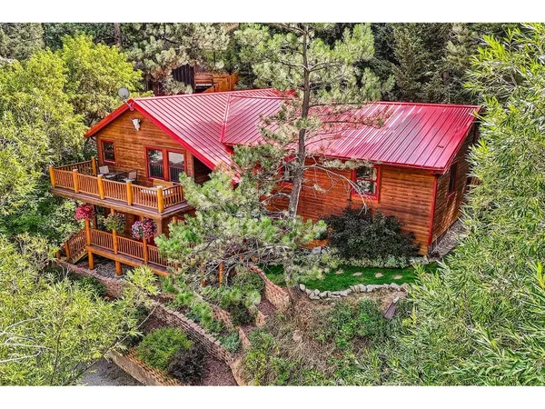 a aerial view of a house with balcony and garden