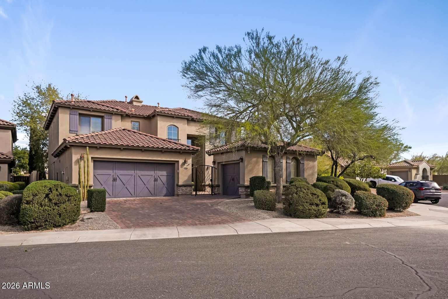 3978 East Hashknife Road Phoenix, AZ 85050 - Photo 1 of 29 a front view of a house with a garden