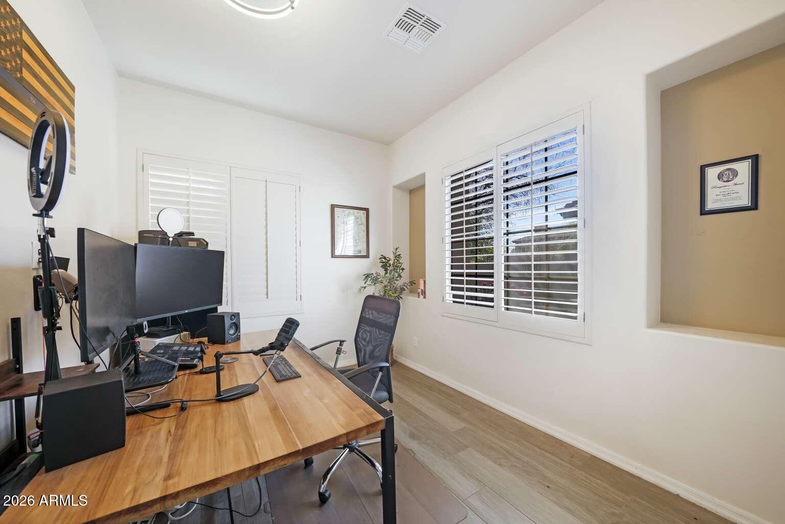 3978 East Hashknife Road Phoenix, AZ 85050 - Photo 11 of 29 a living room with furniture and a flat screen tv