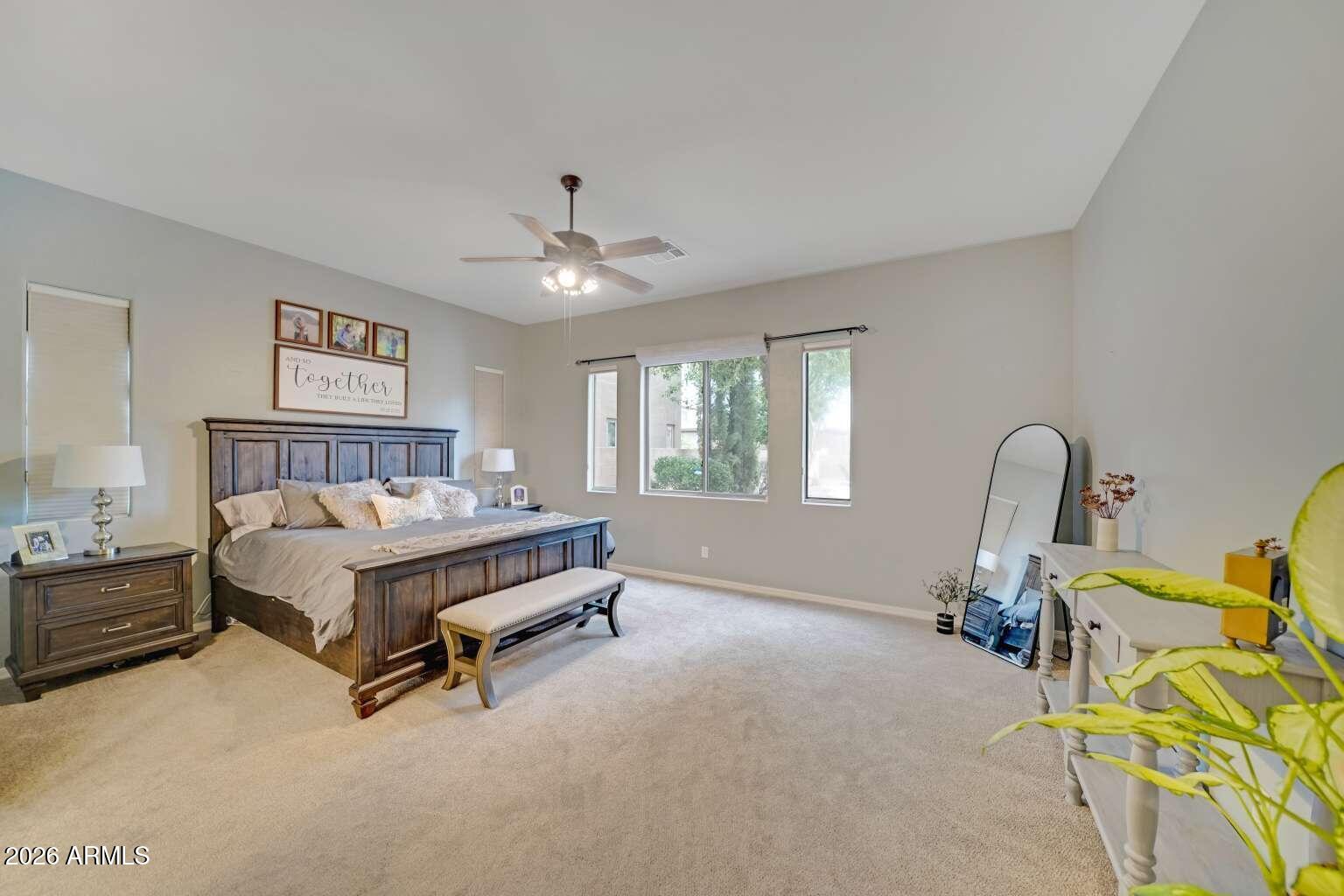3978 East Hashknife Road Phoenix, AZ 85050 - Photo 13 of 29 a spacious bedroom with a bed and a window