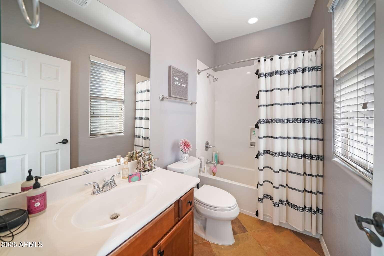 3978 East Hashknife Road Phoenix, AZ 85050 - Photo 19 of 29 a bathroom with a sink toilet and shower
