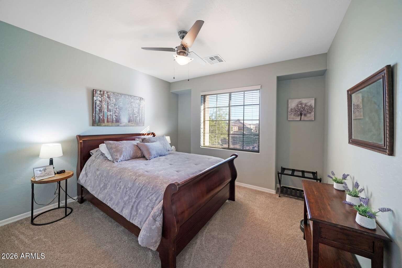 3978 East Hashknife Road Phoenix, AZ 85050 - Photo 21 of 29 a bedroom with bed and window