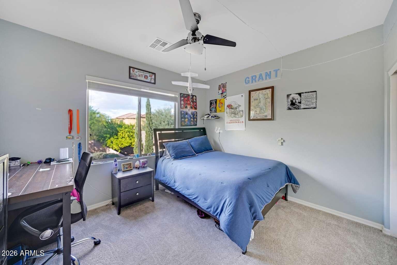3978 East Hashknife Road Phoenix, AZ 85050 - Photo 22 of 29 a bedroom with a bed bed and a large window