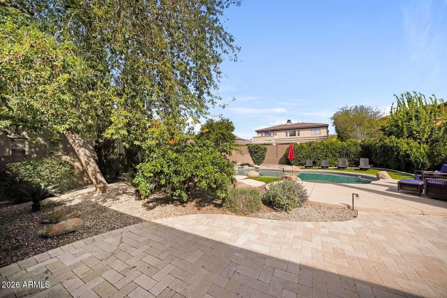 3978 East Hashknife Road Phoenix, AZ 85050 - Photo 26 of 29 a street view with large trees