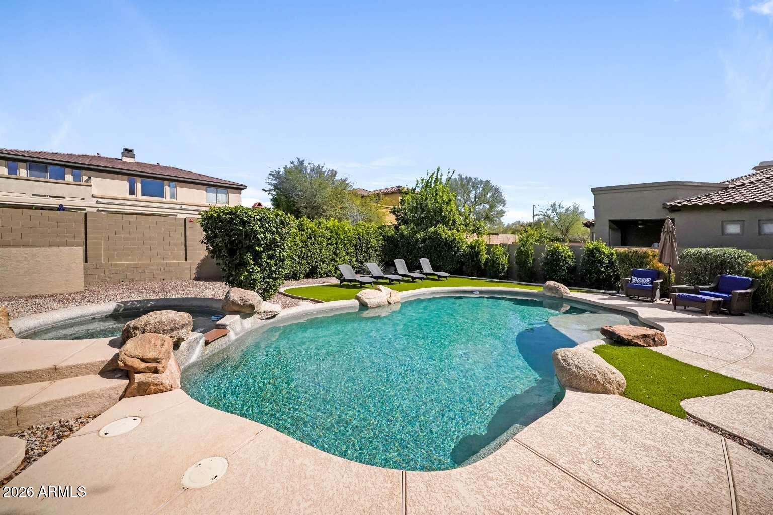 3978 East Hashknife Road Phoenix, AZ 85050 - Photo 28 of 29 a view of a swimming pool with a patio