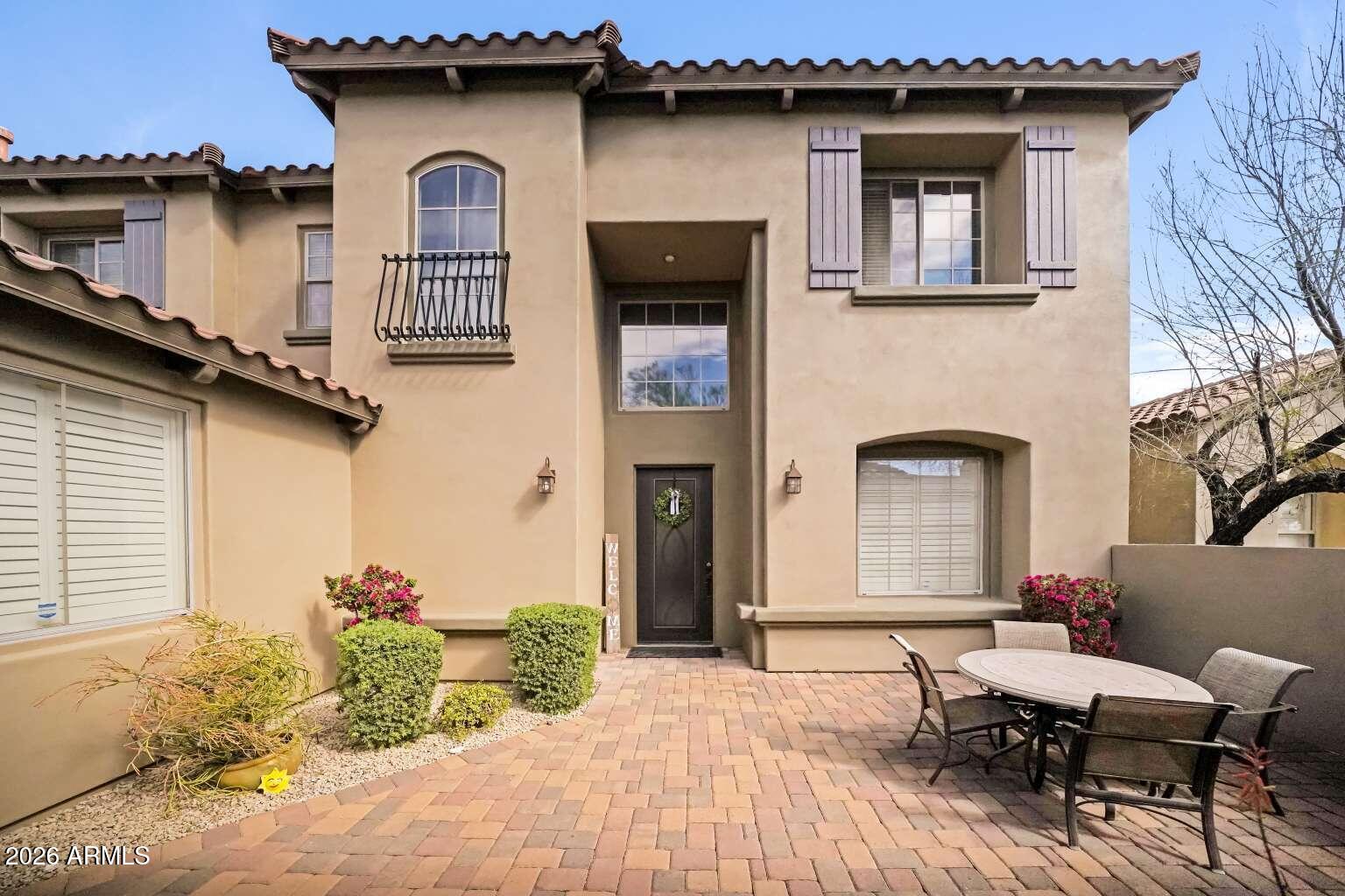 3978 East Hashknife Road Phoenix, AZ 85050 - Photo 4 of 29 a front view of a house with many windows