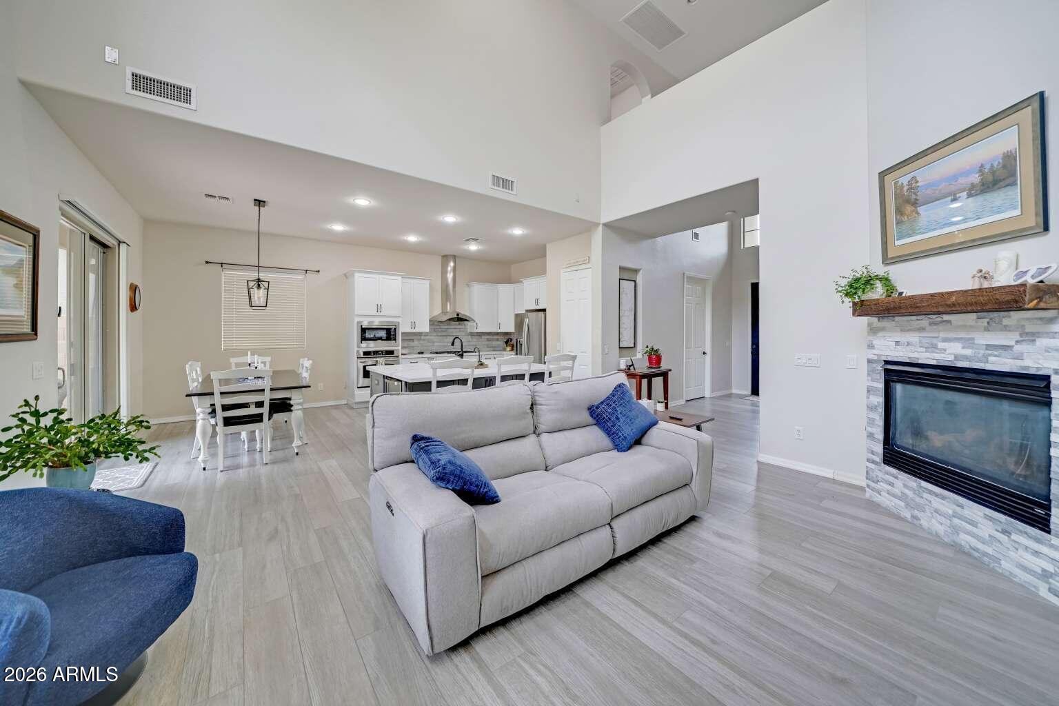 3978 East Hashknife Road Phoenix, AZ 85050 - Photo 7 of 29 a living room with furniture and a fireplace