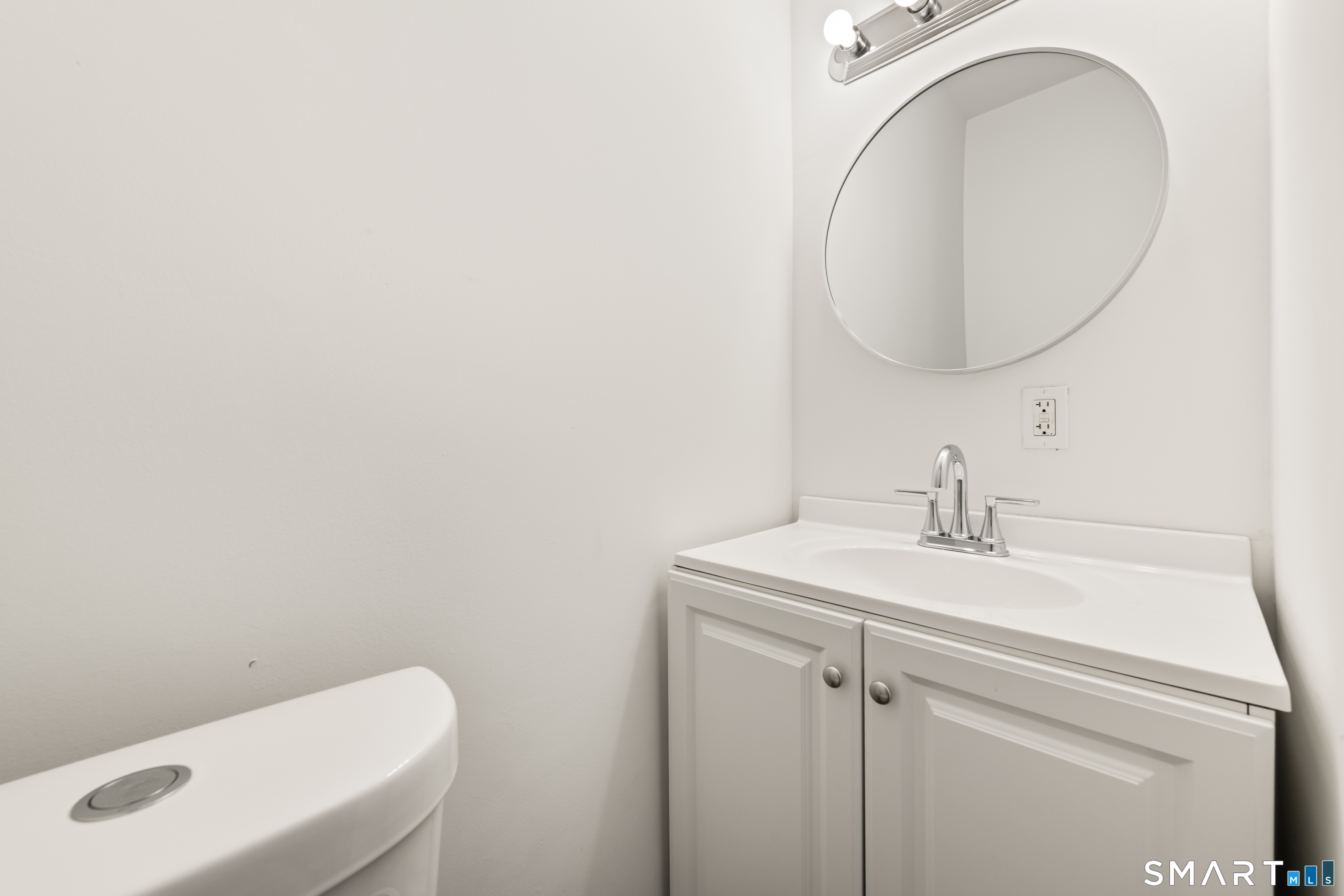 386 Huntington Road Bridgeport, CT 06608 - Photo 18 of 33 a bathroom with a sink and a mirror