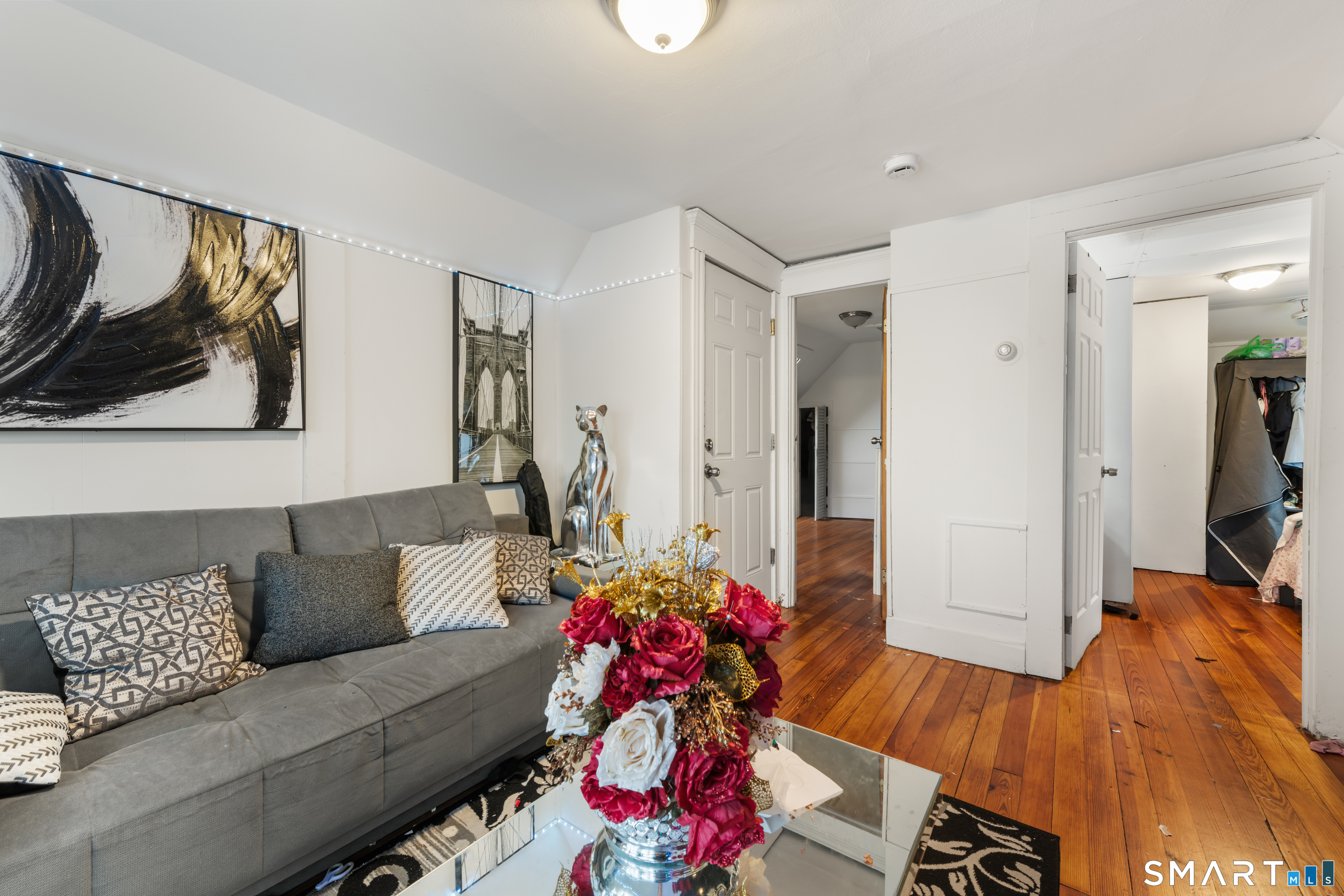 386 Huntington Road Bridgeport, CT 06608 - Photo 23 of 33 a living room with furniture and wooden floor