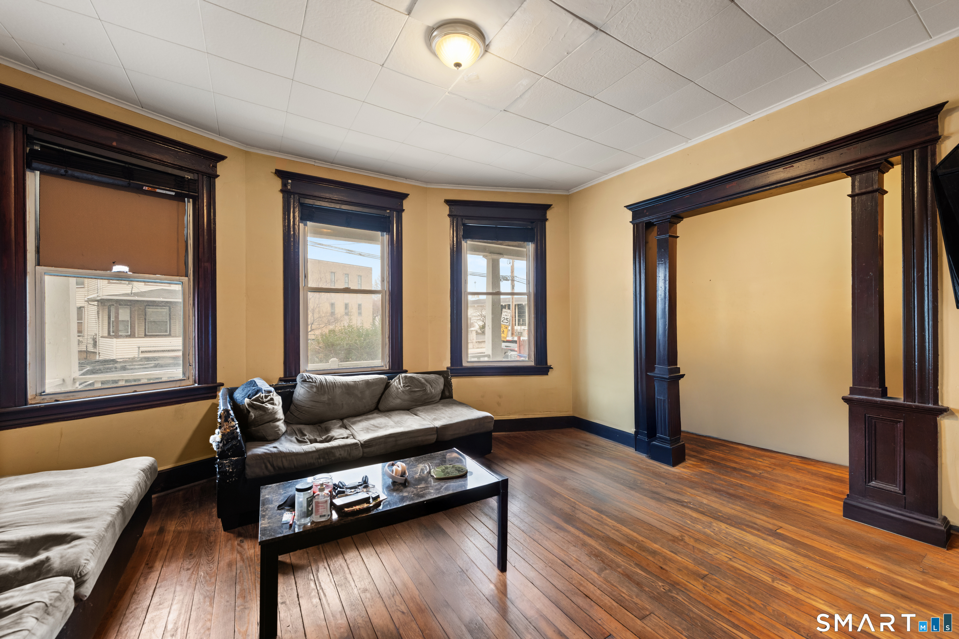 386 Huntington Road Bridgeport, CT 06608 - Photo 10 of 33 a living room with furniture and a window