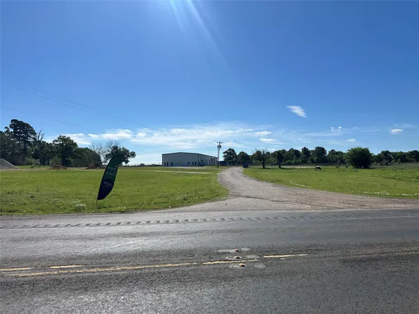 front view of a house with a big yard