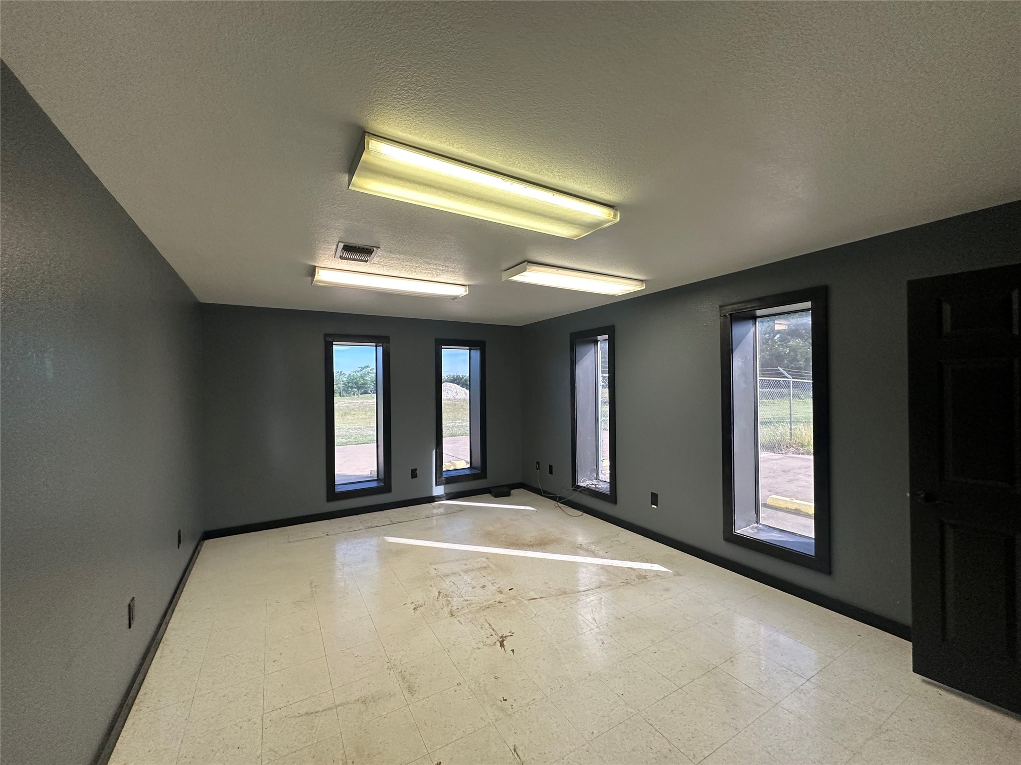 2013 Highway 79 Buffalo, TX 75831 - Photo 17 of 24 a view of an empty room with a fireplace and a window
