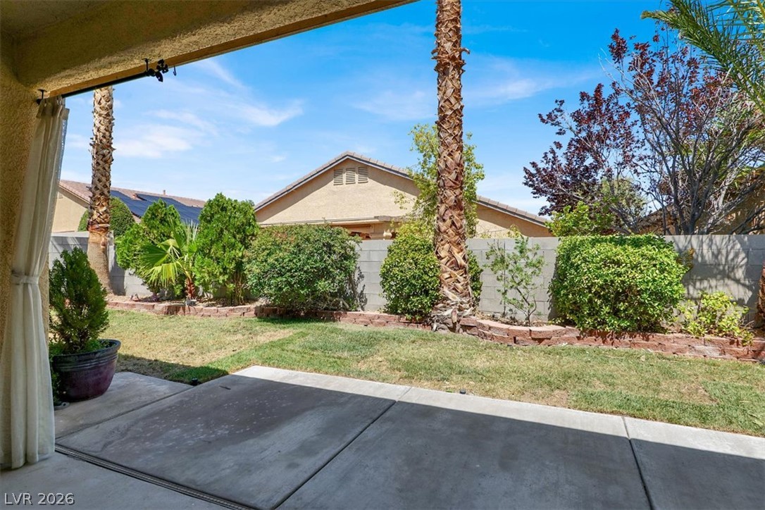 7308 Rustic Meadow Street Las Vegas, NV 89131 - Photo 24 of 27 A spacious backyard provides a comfortable outdoor living area for relaxation and entertainment.