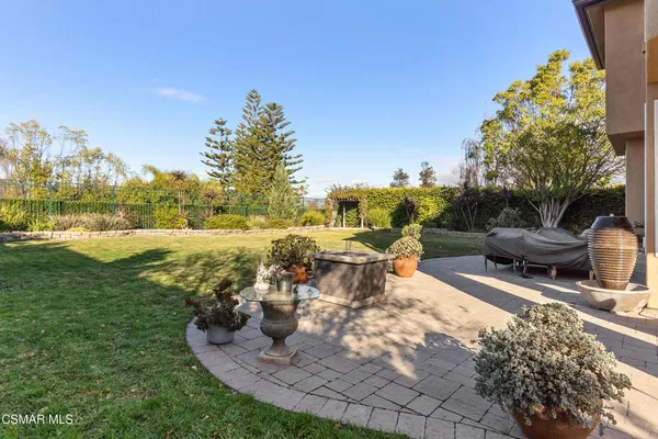 a view of a swimming pool and lounge chairs