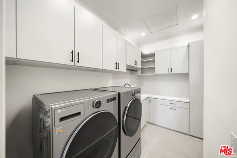 a view of a kitchen with washer and dryer
