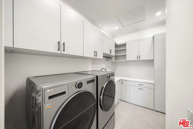 a view of a kitchen with washer and dryer