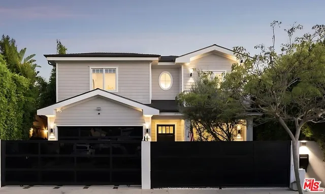 a front view of a house with yard