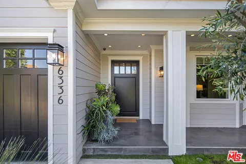 a front view of a house with a porch