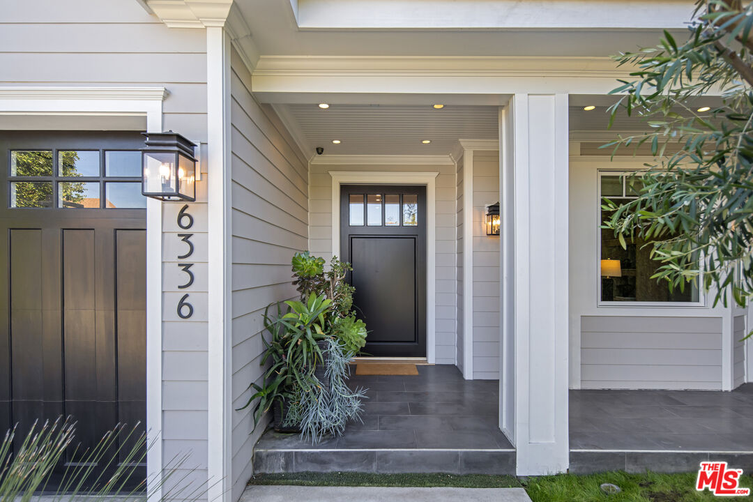 6336 Lindenhurst Avenue Los Angeles, CA 90048 - Photo 3 of 26 a front view of a house with a porch