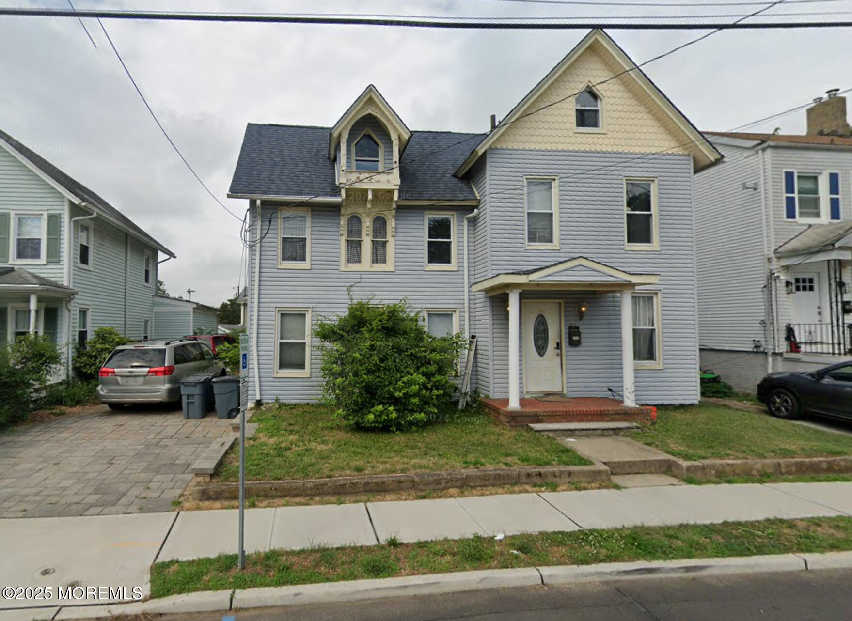 40 Church Street Keyport, NJ 07735 - Photo 1 of 1 a front view of a house with a yard and garage