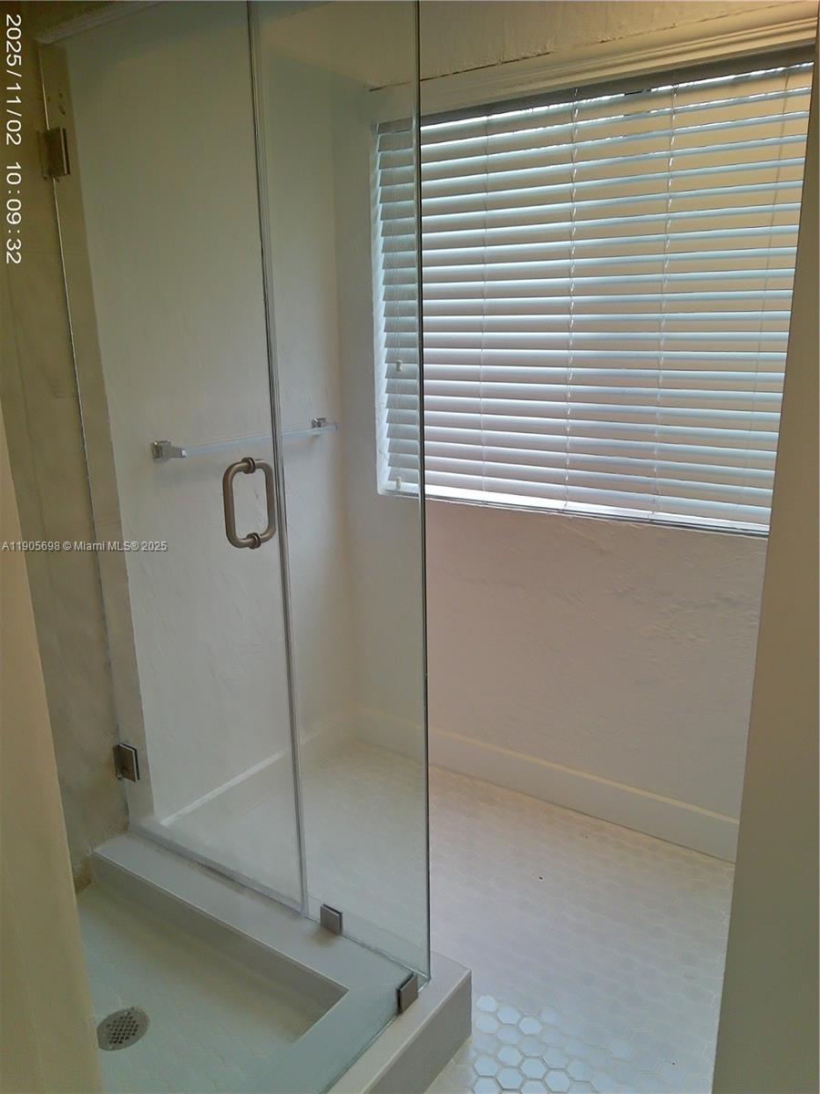 3036 Southwest 27th Avenue, Unit 5 Miami, FL 33133 - Photo 16 of 23 a bathroom with a shower
