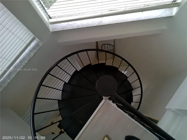 a view of a street with a cars park side of a road