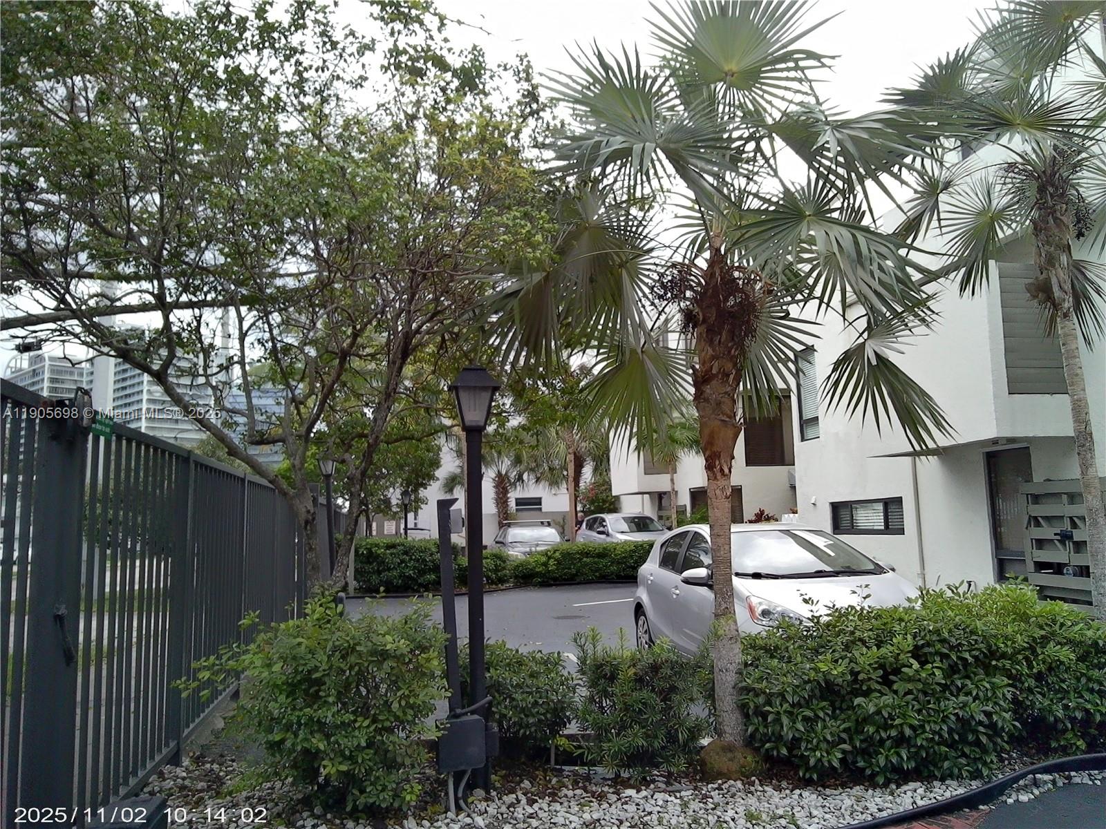 3036 Southwest 27th Avenue, Unit 5 Miami, FL 33133 - Photo 23 of 23 a front view of a house with a garden