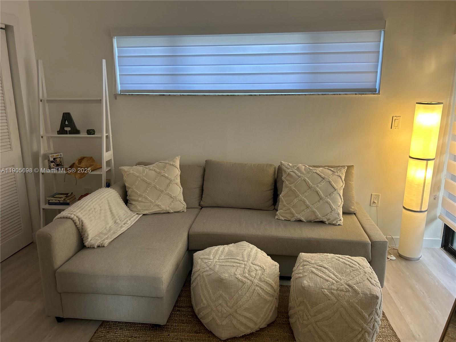 3036 Southwest 27th Avenue, Unit 5 Miami, FL 33133 - Photo 10 of 23 a living room with furniture and a couch