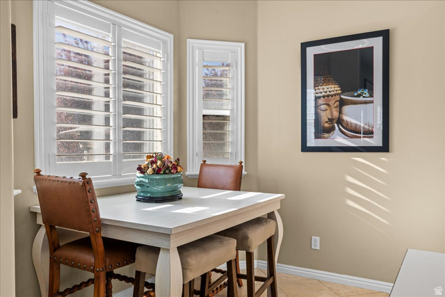 7824 South Sequoia Tree Lane Sandy, UT 84094 - Photo 16 of 43 Dining area featuring baseboards and light tile patterned floors