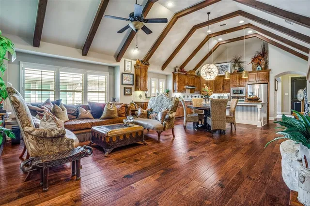 a table room with a chair and a potted plant