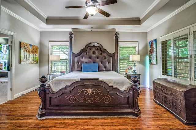 a spacious bathroom with a granite countertop sink a mirror and a bathtub