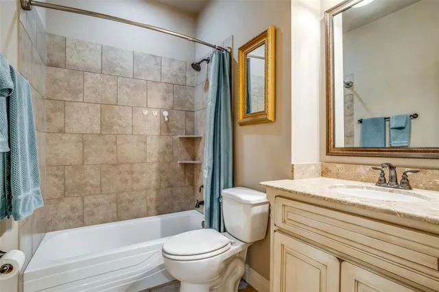 a bedroom with a bed and a table