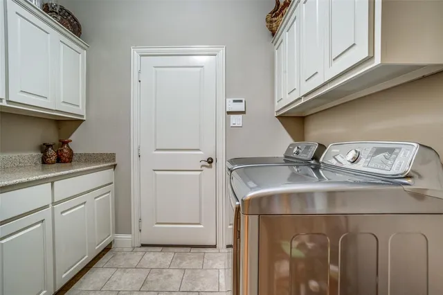 a view of a dining room with furniture large windows and wooden floor