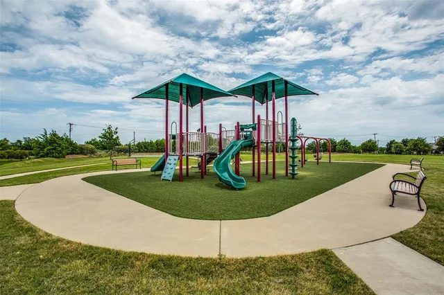 an aerial view of residential building and car parked