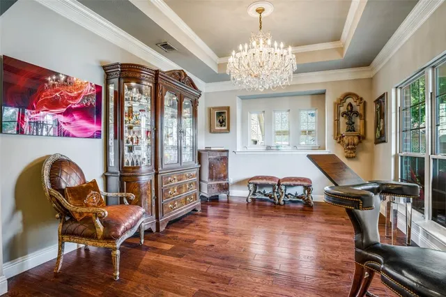 a kitchen with stainless steel appliances granite countertop a stove and a wooden floors