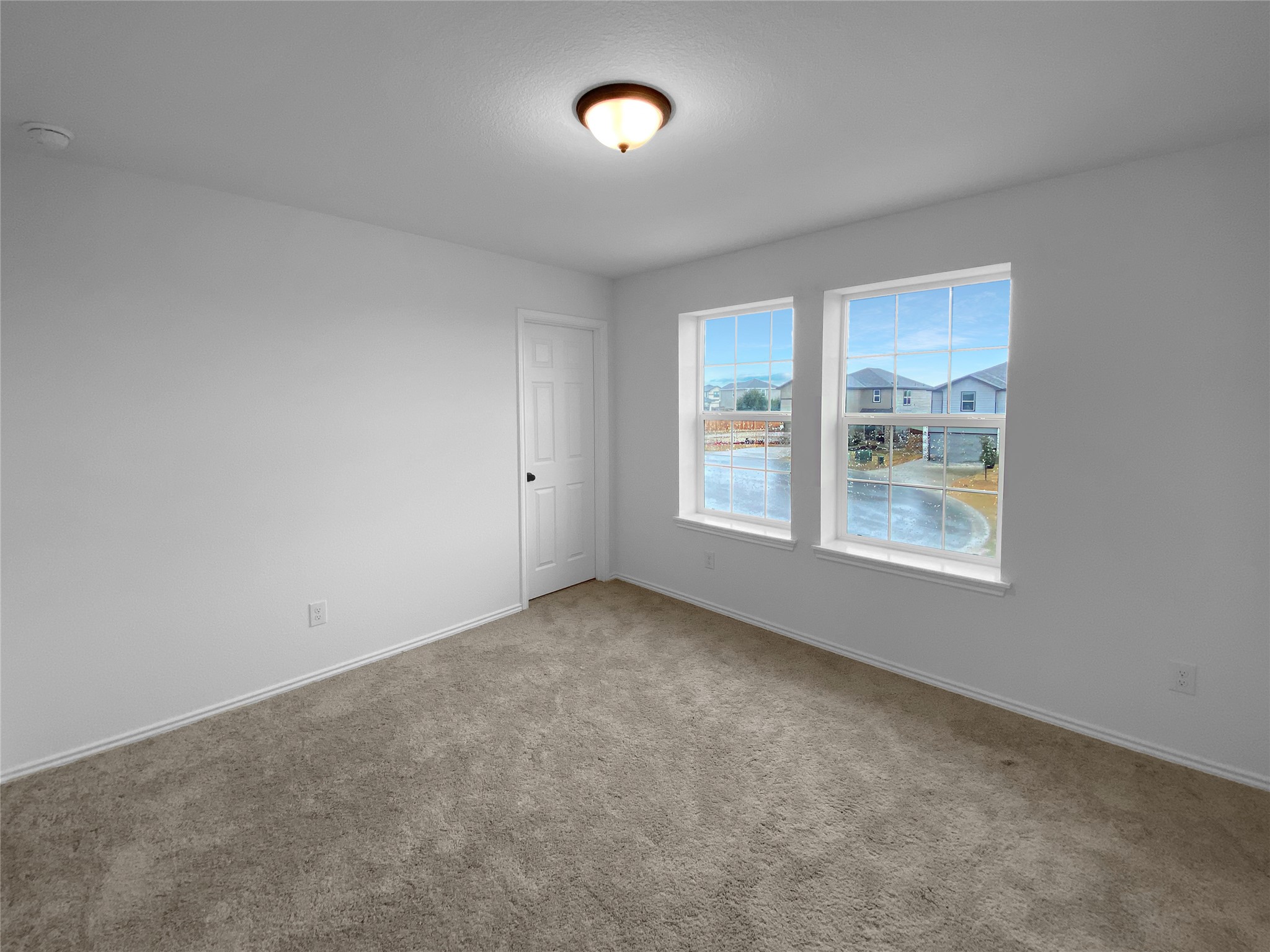 932 Yellow Ribbon Trail Jarrell, TX 76537 - Photo 12 of 26 Spare room featuring baseboards and carpet flooring