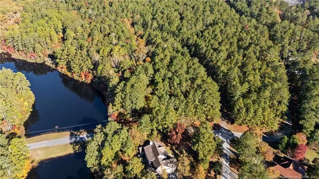 a view of a lake with sitting area