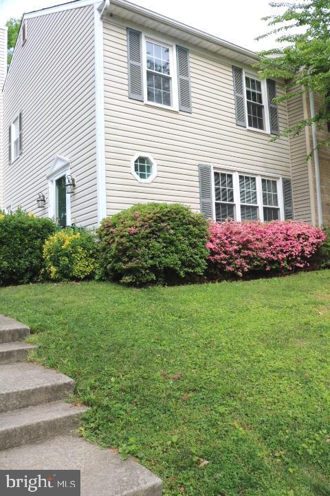7313 Stream Way Springfield, VA 22152 - Photo 1 of 28 a front view of house with yard and green space