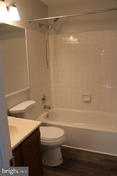 7313 Stream Way Springfield, VA 22152 - Photo 16 of 28 a bathroom with a toilet a sink and a shower