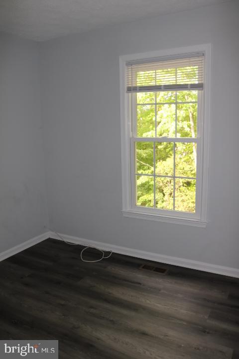 7313 Stream Way Springfield, VA 22152 - Photo 19 of 28 a view of a small space with wooden floor and a window