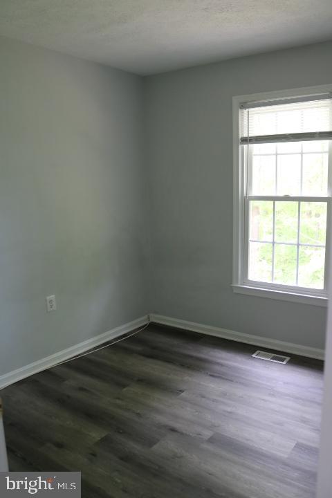 7313 Stream Way Springfield, VA 22152 - Photo 21 of 28 wooden floor and window in an empty room