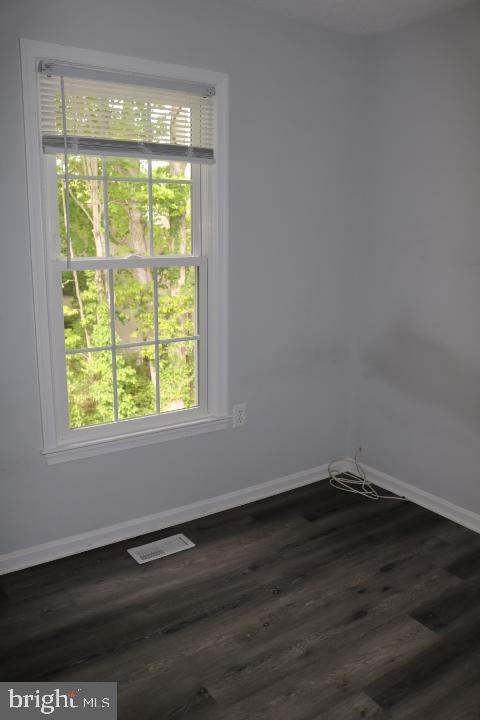 7313 Stream Way Springfield, VA 22152 - Photo 24 of 28 a view of a room that has wooden floor and a window
