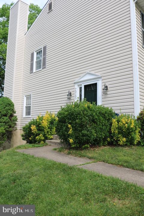 7313 Stream Way Springfield, VA 22152 - Photo 28 of 28 a front view of a house with a garden